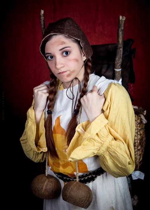Lexi as Patsy in Spamalot, in braids with coconut halves